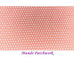 100% algodón, fondo rosado melocotón, círculos blancos